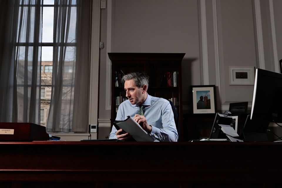 Tánaiste and Finance Minister Simon Harris pictured in his new office. Photo: Gerry Mooney